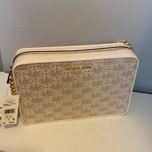 Michael Kors beige strap across handbag